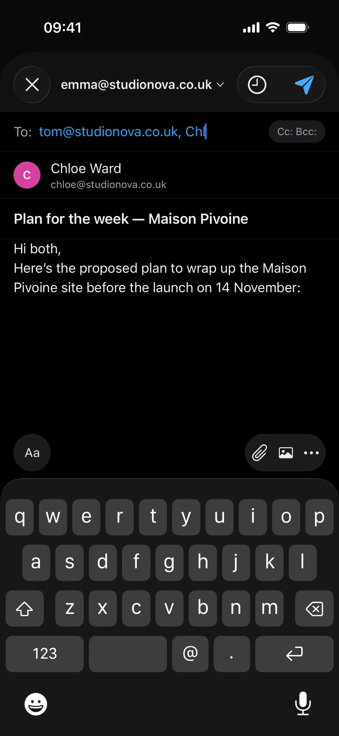 Composing a new message on iPhone with a suggested recipient, an attachment and a signature.